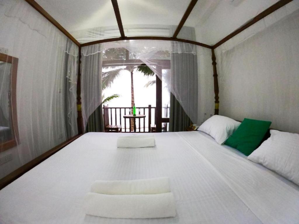 Asa Bay Beach Resort Talpe Exterior foto